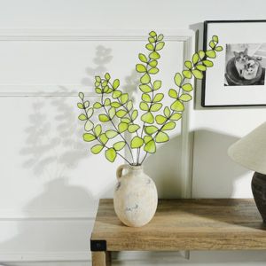 A flower pot with stained glass leaves