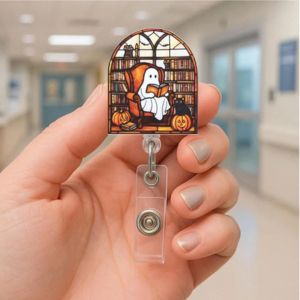 hand holding a reading ghost design ornament