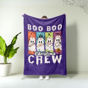women holding a purple blanket