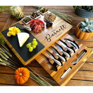 personalized charcuterie board full of food on a table