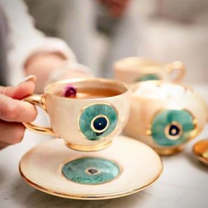 a set of evil eye cup and saucer