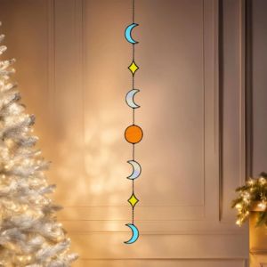 a suncatcher with moon and diamonds patterns