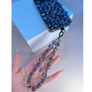 hand holding a crystal phone charm