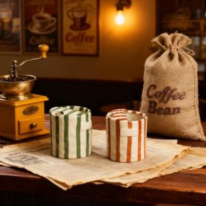 two ceramic mugs with stripes