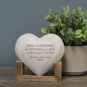 A heart shaped keepsake with text imprinted on it