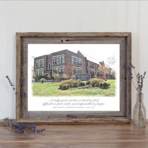 A watercolor painting in a wooden frame on a table