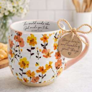 a floral coffee cup with a printed verse on the rim