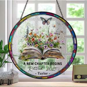 a round suncatcher with book flowers and butterfly design