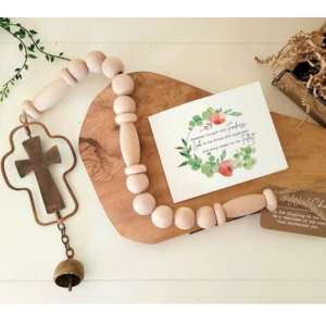 christian cross wind chyme on a table