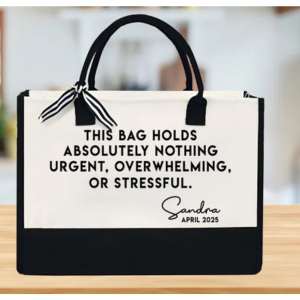 tote bag with owrding on it sitting on a table