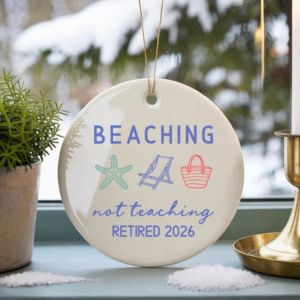 a christmas ornament made out of white ceramic with colorfl retirement text on it