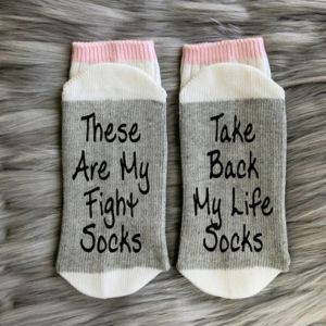 a pair of socks with text on them