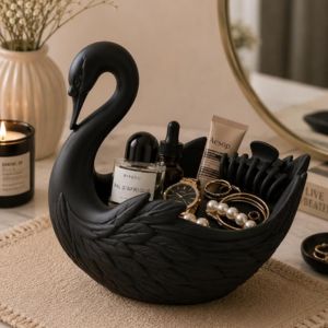 Black swan shaped dish holding jewelry and small items