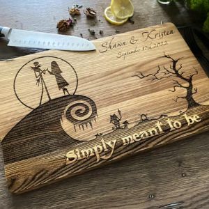 Wood cutting board engraved with names and skeleton couple