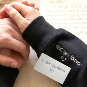 embroidered message on inside of a sweatshirt sleeve