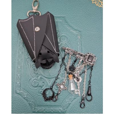 Black leather bat shaped pouch with silver kilt pin