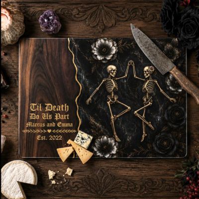 Glass cutting board with engraved skeleton couple design