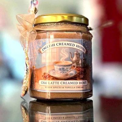 Glass jar of creamed honey with chai latte label
