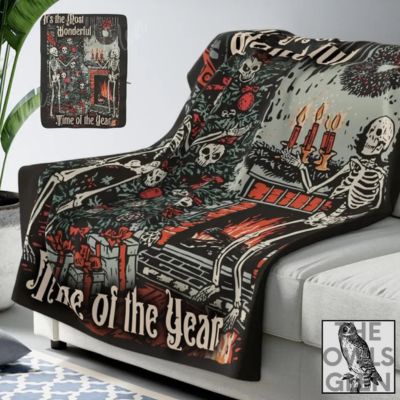 Sherpa blanket with skeletons decorating fireplace scene