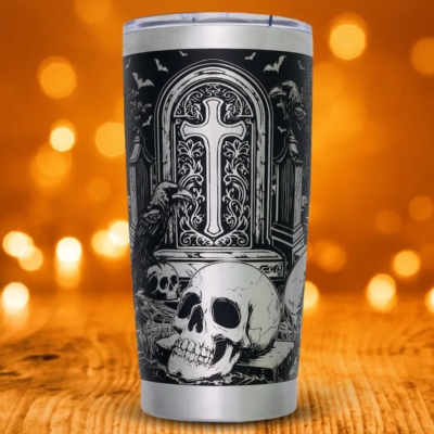 Steel tumbler engraved with skull, raven, and gothic cross