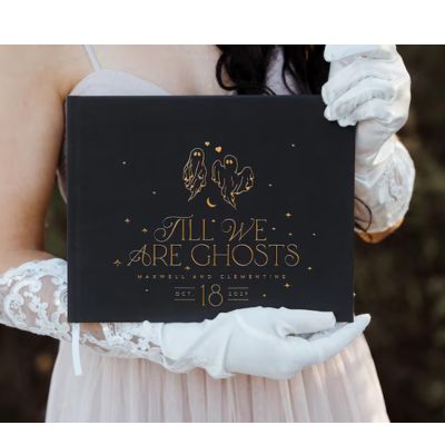 woman holding a personalized wedding guest album