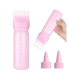 Pink root comb applicator bottle for applying hair oil neatly to the scalp and roots.